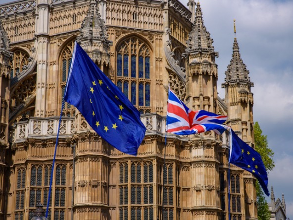 UK and EU flags outside the Palace of Westminster